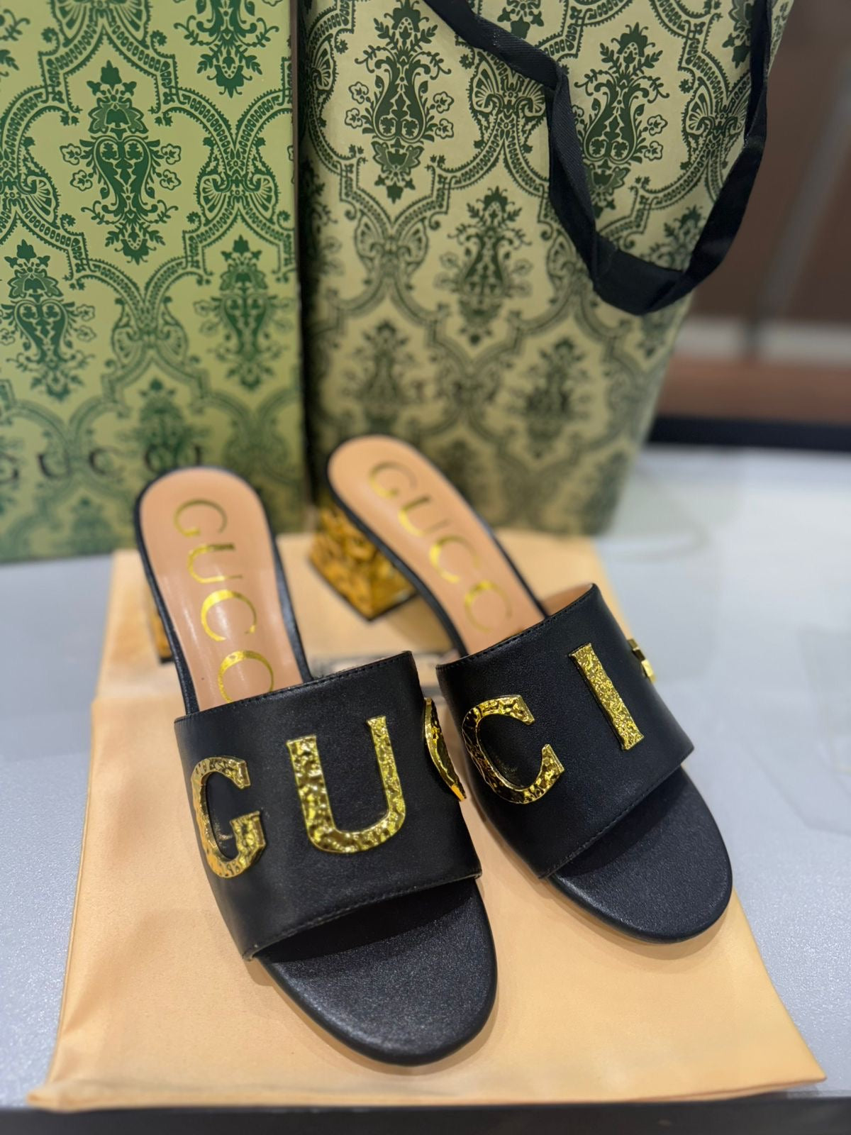 GUCCI Matelassé Heeled Sandals – Gold-Tone Logo | White & Black