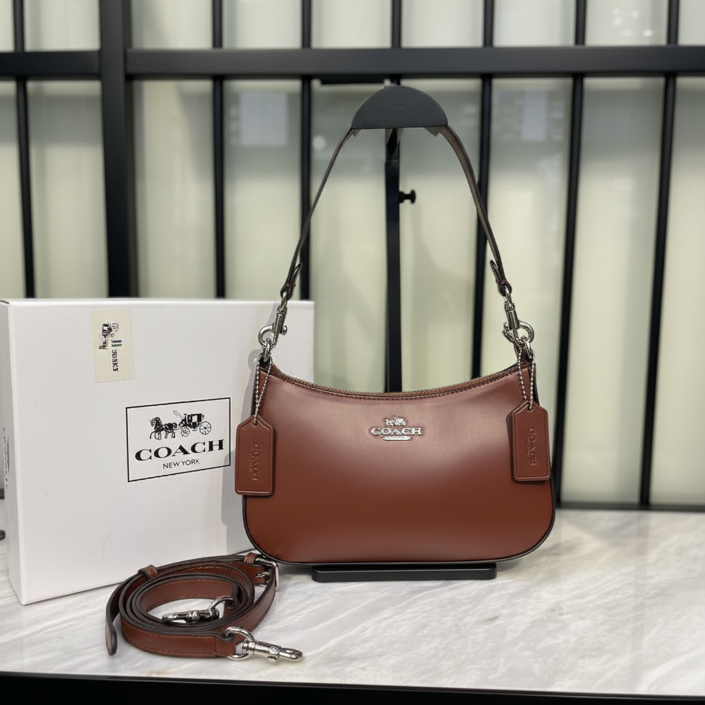 Coach Teri Shoulder Bag Tan Brown on white marble surface