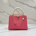 Louis Vuitton Capucines Hot Pink front view on white marble