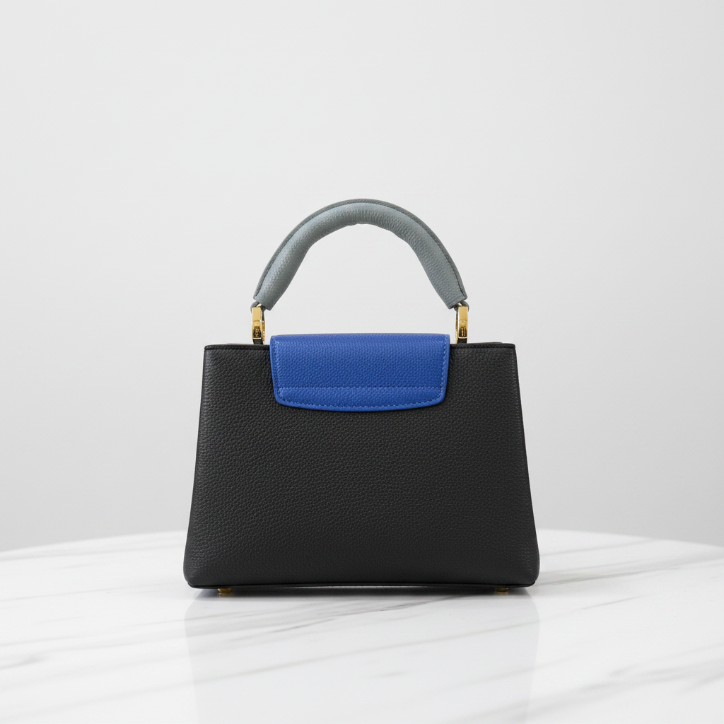 Louis Vuitton Capucines back view on white marble