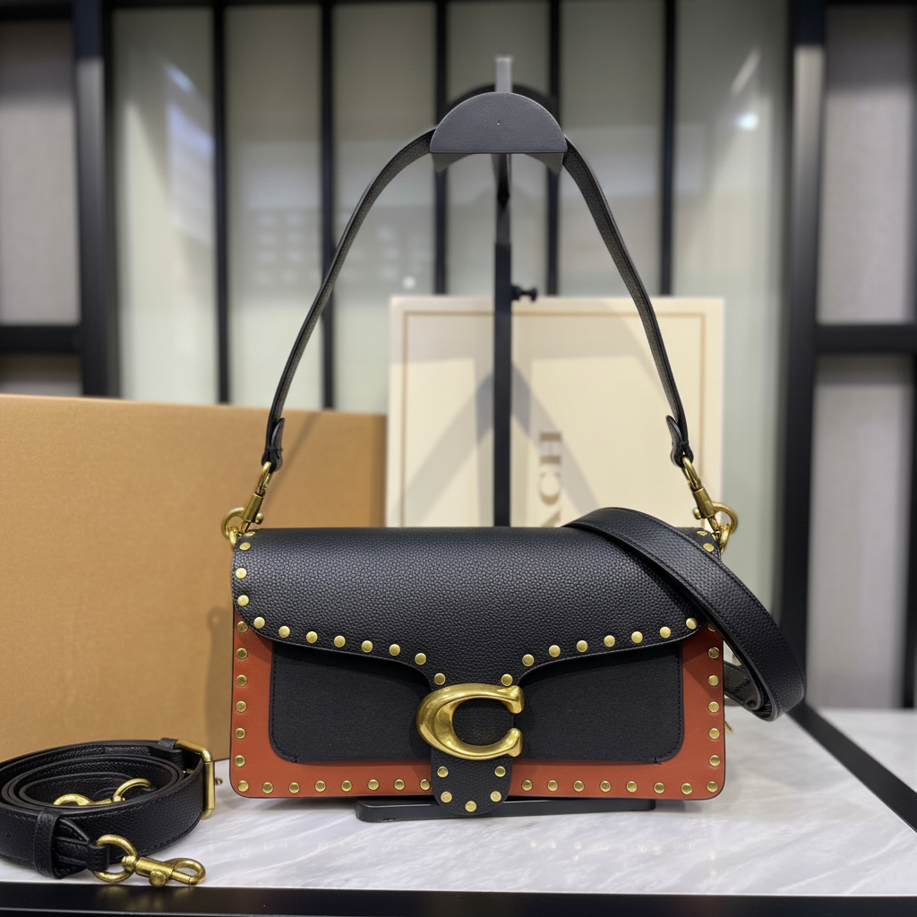Coach Tabby Shoulder Bag 26 with Rivets on white marble surface