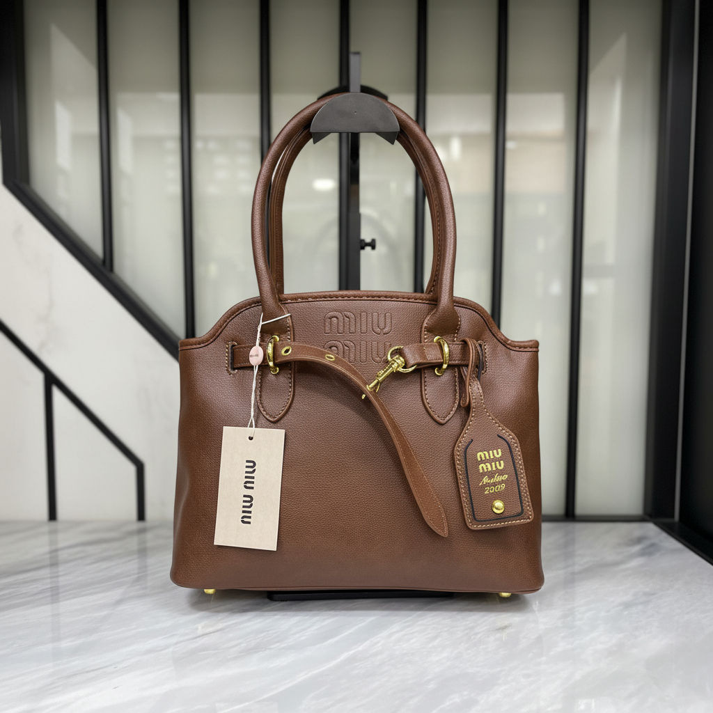 Miu Miu Aventure Bag Brown on white marble surface