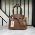 Miu Miu Aventure Bag Brown on white marble surface