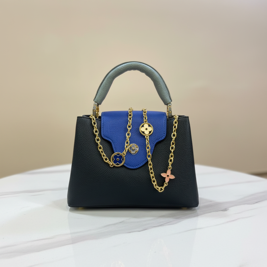 Louis Vuitton Capucines blue flap front view on white marble