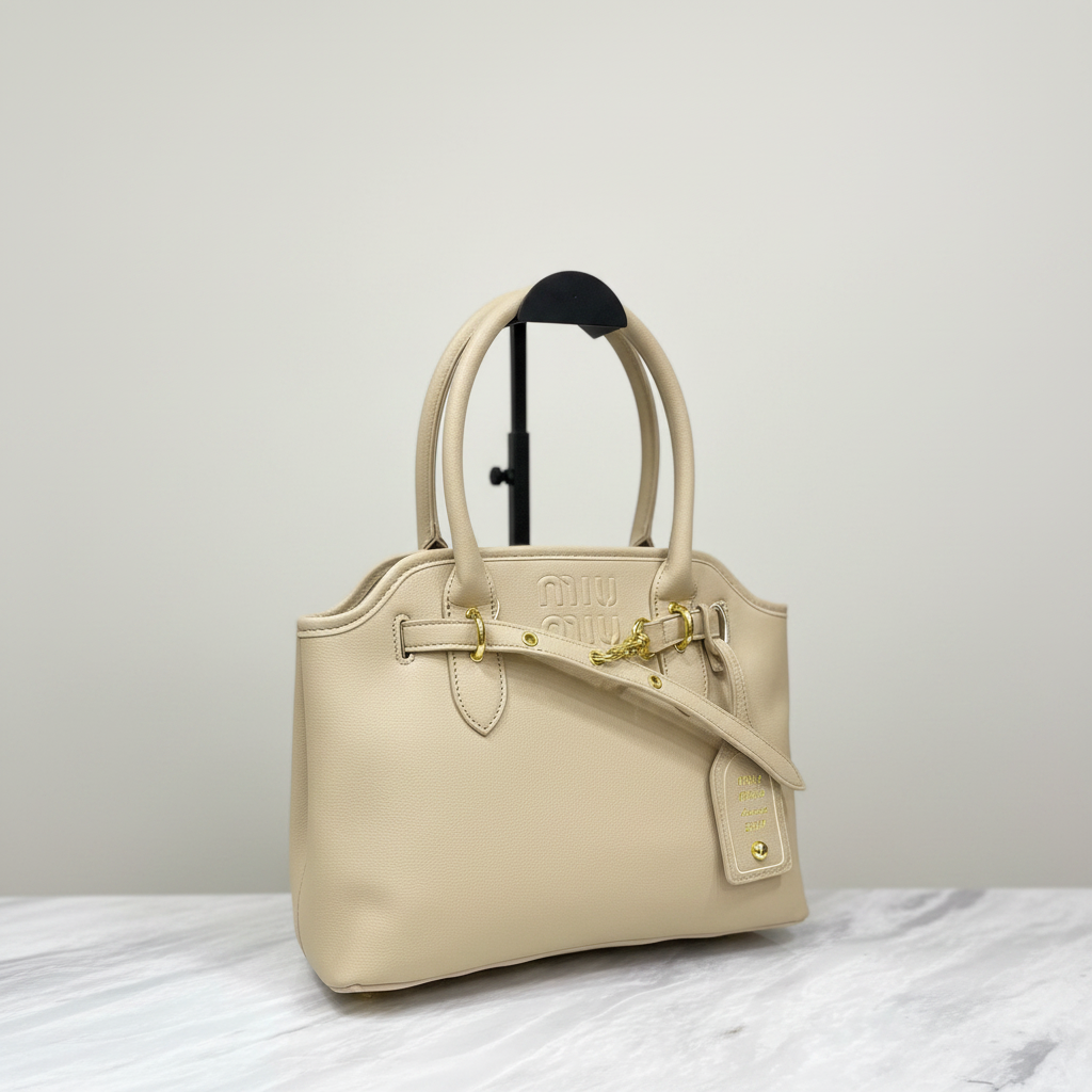Miu Miu Aventure Bag Cream Beige on white marble surface