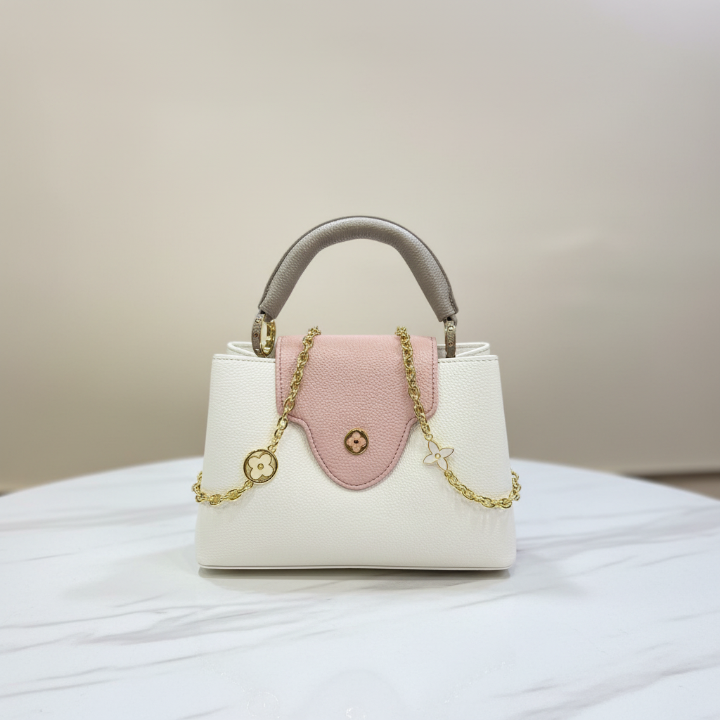 Louis Vuitton Capucines Cream White front view on white marble